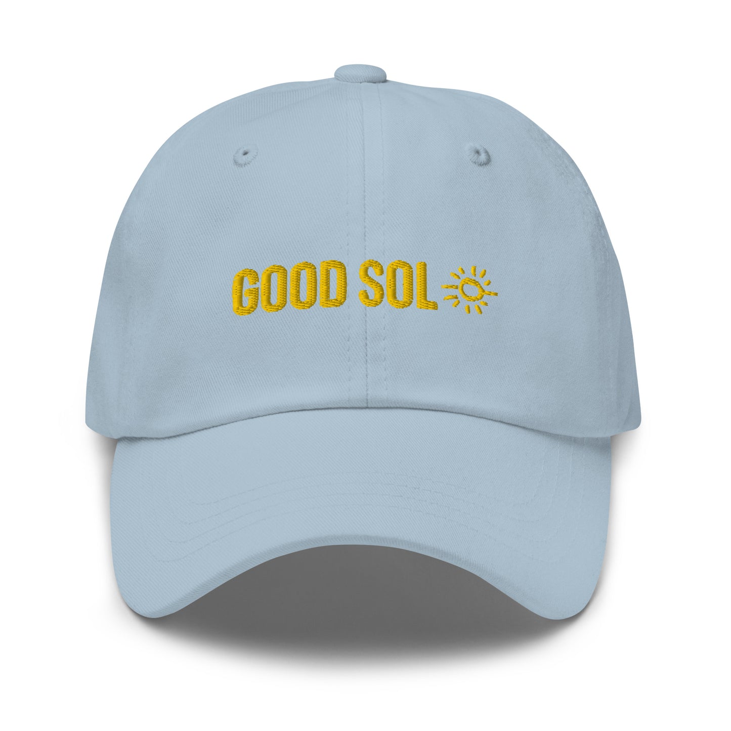 A blue dad hat with the word Good Sol and a drawing of a sun is threaded at the top.